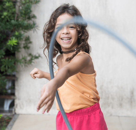 Girl swinging hula-hoop, as ideal summer professional development for teachers. Photo credit: Patricia Prudente